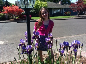 Vivian and the irises in bloom in our new front yard. 